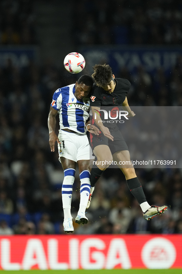 Pau Cubarsi centre-back of Barcelona and Spain and Sheraldo Becker centre-forward of Real Sociedad and Netherlands compete for the ball duri...