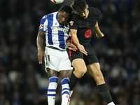 Pau Cubarsi centre-back of Barcelona and Spain and Sheraldo Becker centre-forward of Real Sociedad and Netherlands compete for the ball duri...