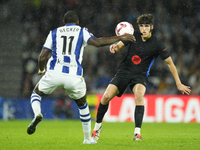 Pau Cubarsi centre-back of Barcelona and Spain and Sheraldo Becker centre-forward of Real Sociedad and Netherlands compete for the ball duri...