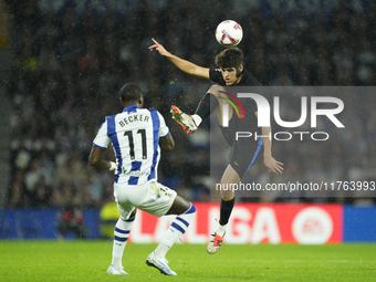 Pau Cubarsi centre-back of Barcelona and Spain and Sheraldo Becker centre-forward of Real Sociedad and Netherlands compete for the ball duri...