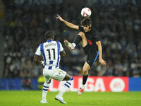 Pau Cubarsi centre-back of Barcelona and Spain and Sheraldo Becker centre-forward of Real Sociedad and Netherlands compete for the ball duri...