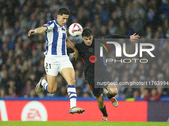 Pedri central midfield of Barcelona and Spain and Nayef Aguerd centre-back of Real Sociedad and Morocco during the LaLiga match between Real...