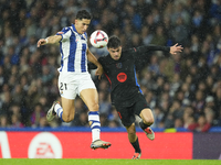 Pedri central midfield of Barcelona and Spain and Nayef Aguerd centre-back of Real Sociedad and Morocco during the LaLiga match between Real...