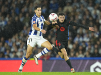 Pedri central midfield of Barcelona and Spain and Nayef Aguerd centre-back of Real Sociedad and Morocco during the LaLiga match between Real...