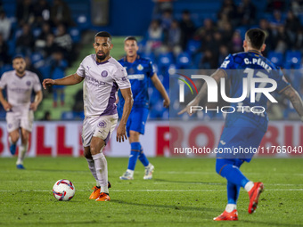 Yangel Herrera of Girona FC (left) is in action against Carles Perez of Getafe CF (right) during the La Liga EA Sports 2024/25 football matc...