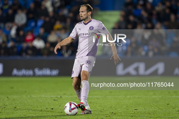 Daley Blind of Girona FC is in action with the ball during the La Liga EA Sports 2024/25 football match between Getafe CF and Girona FC at E...