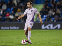 Daley Blind of Girona FC is in action with the ball during the La Liga EA Sports 2024/25 football match between Getafe CF and Girona FC at E...