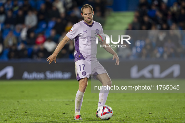 Daley Blind of Girona FC is in action with the ball during the La Liga EA Sports 2024/25 football match between Getafe CF and Girona FC at E...