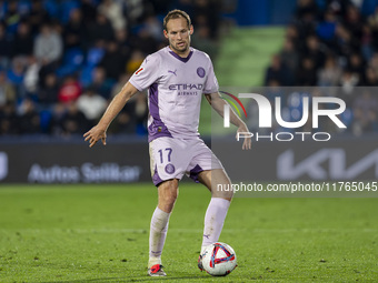 Daley Blind of Girona FC is in action with the ball during the La Liga EA Sports 2024/25 football match between Getafe CF and Girona FC at E...