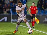 Yangel Herrera of Girona FC is in action with the ball during the La Liga EA Sports 2024/25 football match between Getafe CF and Girona FC a...