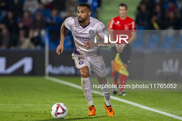 Yangel Herrera of Girona FC is in action with the ball during the La Liga EA Sports 2024/25 football match between Getafe CF and Girona FC a...