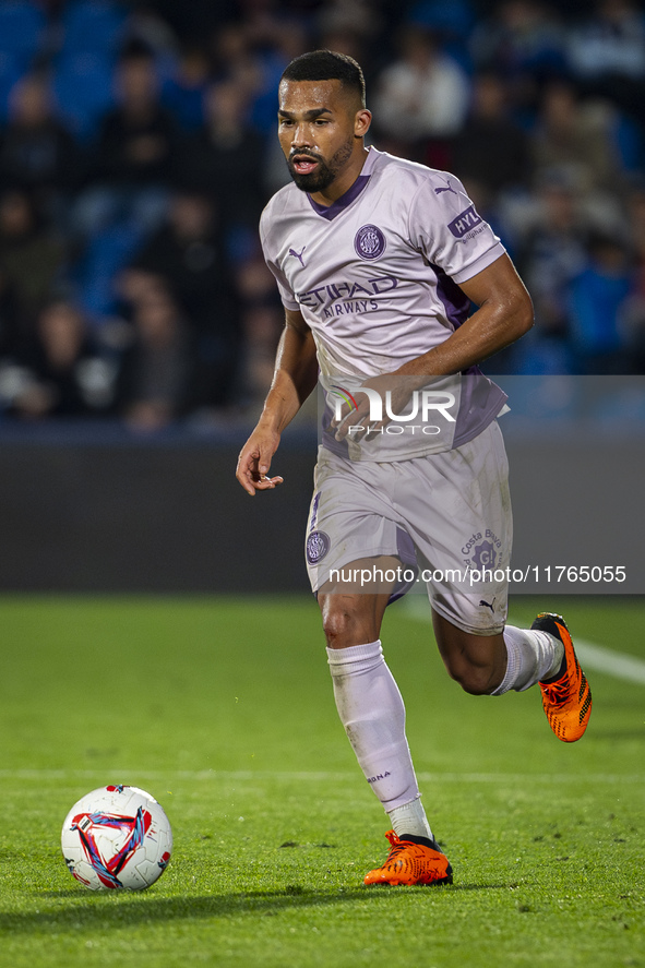 Yangel Herrera of Girona FC is in action with the ball during the La Liga EA Sports 2024/25 football match between Getafe CF and Girona FC a...