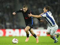 Fermin Lopez central midfield of Barcelona and Spain and Aihen Munoz left-back of Real Sociedad and Spain  aaco during the LaLiga match betw...