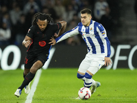 Jules Kounde centre-back of Barcelona and France and Ander Barrenetxea left winger of Real Sociedad and Spain compete for the ball during th...