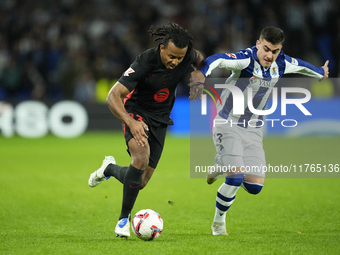 Jules Kounde centre-back of Barcelona and France and Ander Barrenetxea left winger of Real Sociedad and Spain compete for the ball during th...