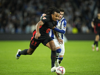 Jules Kounde centre-back of Barcelona and France and Ander Barrenetxea left winger of Real Sociedad and Spain compete for the ball during th...