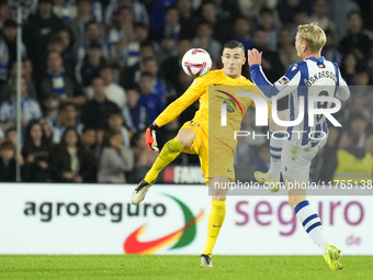 Inaki Pena goalkeeper of Barcelona and Spain and Orri Oskarsson centre-forward of Real Sociedad and Iceland compete for the ball during the...