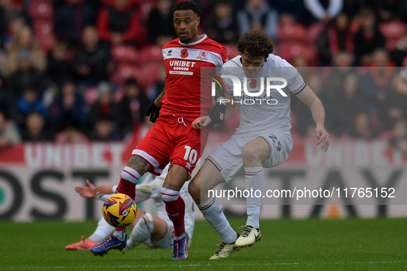 Delano Burgzorg of Middlesbrough battles with Tom Holmes of Luton Town during the Sky Bet Championship match between Middlesbrough and Luton...