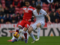 Delano Burgzorg of Middlesbrough battles with Tom Holmes of Luton Town during the Sky Bet Championship match between Middlesbrough and Luton...