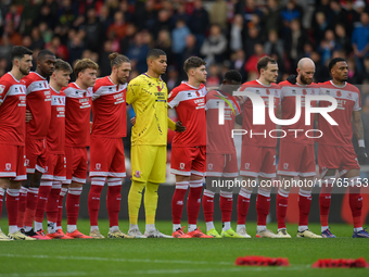 Middlesbrough FC players line up to pay respects for Remembrance Sunday during the Sky Bet Championship match between Middlesbrough and Luto...