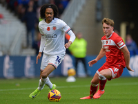 Tahith Chong of Luton Town and Aidan Morris of Middlesbrough participate in the Sky Bet Championship match between Middlesbrough and Luton T...