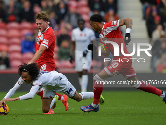 Aidan Morris of Middlesbrough and Tahith Chong of Luton Town tangle for the ball during the Sky Bet Championship match between Middlesbrough...