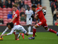 Aidan Morris of Middlesbrough and Tahith Chong of Luton Town tangle for the ball during the Sky Bet Championship match between Middlesbrough...