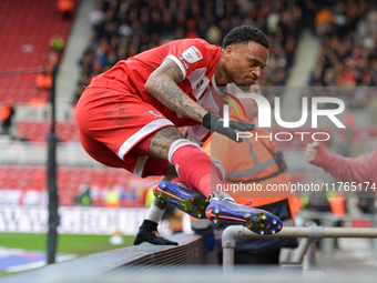 Delano Burgzorg of Middlesbrough leaps the barriers after opening the scoring for Middlesbrough during the Sky Bet Championship match betwee...