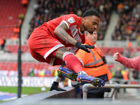 Delano Burgzorg of Middlesbrough leaps the barriers after opening the scoring for Middlesbrough during the Sky Bet Championship match betwee...