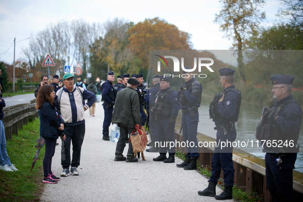 Residents support the 'ecureuils' living in trees that are to be cut for the LGV project. The gendarmerie blocks access to one of the rivers...