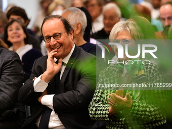 Former President of the Republic Francois Hollande and Mayor of Vaulx en Velin Helene Geoffroy meet in Lyon, France, on November 10, 2024, f...