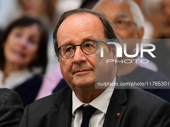 Former President of the Republic Francois Hollande and Mayor of Vaulx en Velin Helene Geoffroy meet in Lyon, France, on November 10, 2024, f...