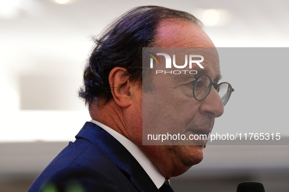 Former President of the Republic Francois Hollande and Mayor of Vaulx en Velin Helene Geoffroy meet in Lyon, France, on November 10, 2024, f...