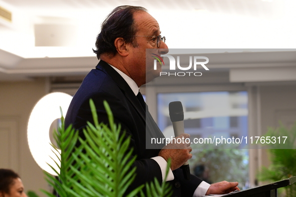 Former President of the Republic Francois Hollande and Mayor of Vaulx en Velin Helene Geoffroy meet in Lyon, France, on November 10, 2024, f...