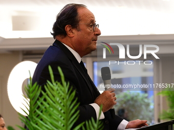 Former President of the Republic Francois Hollande and Mayor of Vaulx en Velin Helene Geoffroy meet in Lyon, France, on November 10, 2024, f...