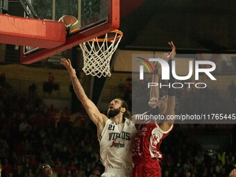 Tornik'e Shengelia of Virtus Bologna and Kaodirichi Akobundu-Ehiogu of Openjobmetis Varese participate in the LBA Italy Championship match b...