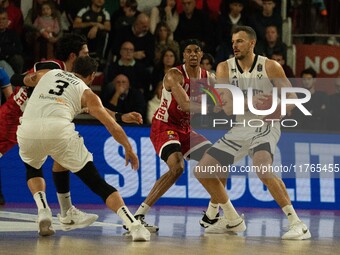 Ante Zizic of Virtus Bologna and Kaodirichi Akobundu-Ehiogu of Openjobmetis Varese compete during the LBA Italy Championship match between O...