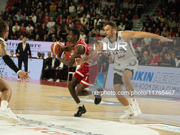 Jordan Harris of Openjobmetis Varese and Ante Zizic of Virtus Bologna participate in the LBA Italy Championship match between Openjobmetis V...