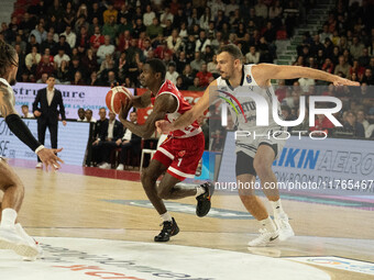 Jordan Harris of Openjobmetis Varese and Ante Zizic of Virtus Bologna participate in the LBA Italy Championship match between Openjobmetis V...