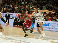 Jordan Harris of Openjobmetis Varese and Ante Zizic of Virtus Bologna participate in the LBA Italy Championship match between Openjobmetis V...