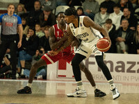 Will Clyburn of Virtus Bologna and Jordan Harris of Openjobmetis Varese compete during the LBA Italy Championship match between Openjobmetis...