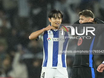 Takefusa Kubo right winger of Real Sociedad and Japan and Gavi central midfield of Barcelona and Spain change the t-shirt during the LaLiga...