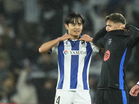 Takefusa Kubo right winger of Real Sociedad and Japan and Gavi central midfield of Barcelona and Spain change the t-shirt during the LaLiga...