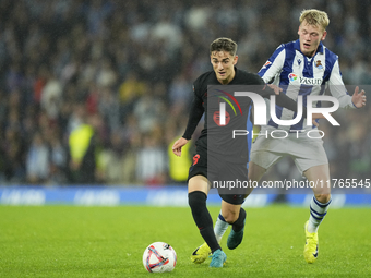 Gavi central midfield of Barcelona and Spain and Orri Oskarsson centre-forward of Real Sociedad and Iceland compete for the ball during the...