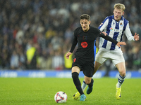 Gavi central midfield of Barcelona and Spain and Orri Oskarsson centre-forward of Real Sociedad and Iceland compete for the ball during the...