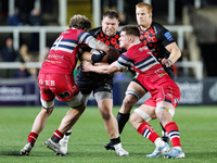 Richard Palframan of Newcastle Falcons is tackled during the Premiership Cup Pool A match between Newcastle Falcons and Doncaster Knights at...