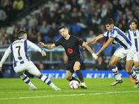 Robert Lewandowski centre-forward of Barcelona and Poland surrounded by Real Sociedad players during the LaLiga match between Real Sociedad...