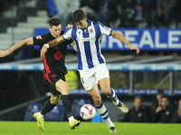 Robert Lewandowski centre-forward of Barcelona and Poland and Nayef Aguerd centre-back of Real Sociedad and Morocco compete for the ball dur...