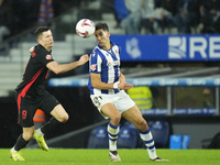 Robert Lewandowski centre-forward of Barcelona and Poland and Nayef Aguerd centre-back of Real Sociedad and Morocco compete for the ball dur...