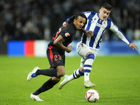 Jules Kounde centre-back of Barcelona and France and Ander Barrenetxea left winger of Real Sociedad and Spain compete for the ball during th...